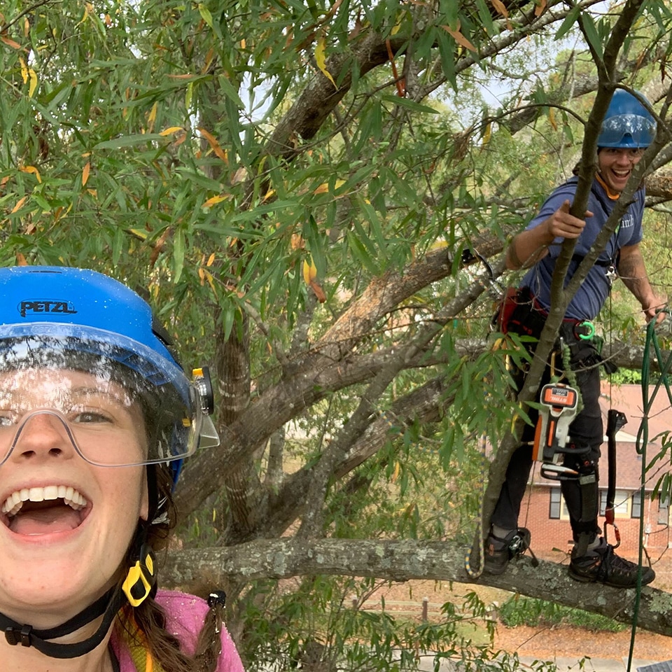 Olivia and Peter are all smiles in the canopy of an Oak tree.